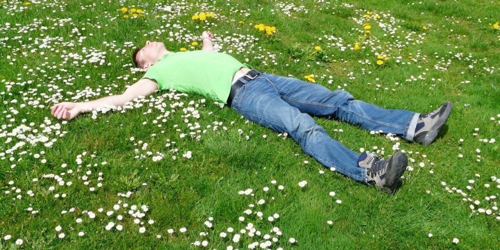 Man Lying In Grass